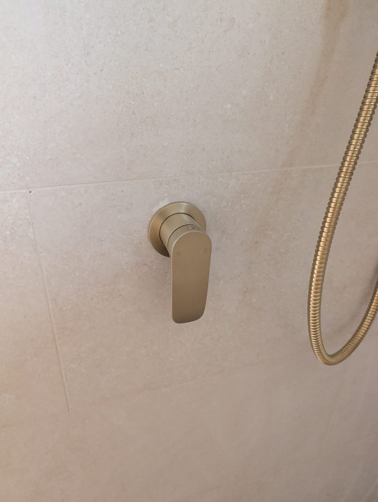 Brushed-brass shower mixer