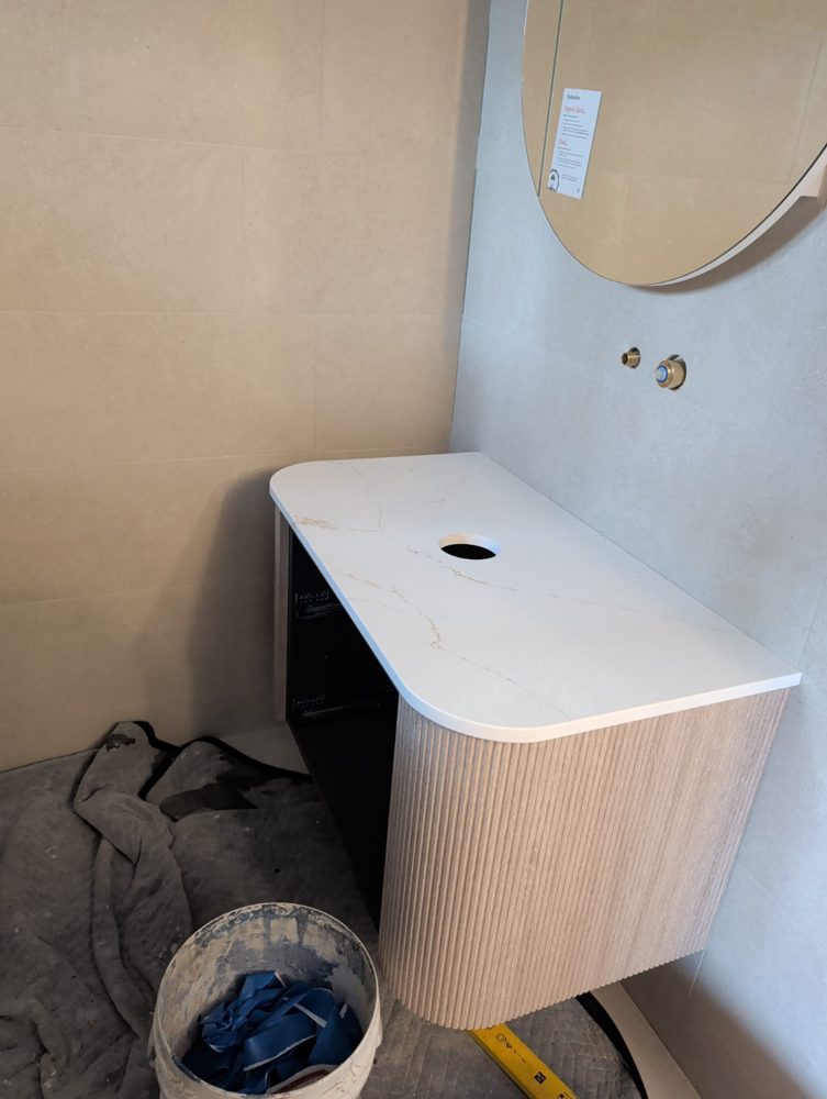 Stone-top vanity installed
